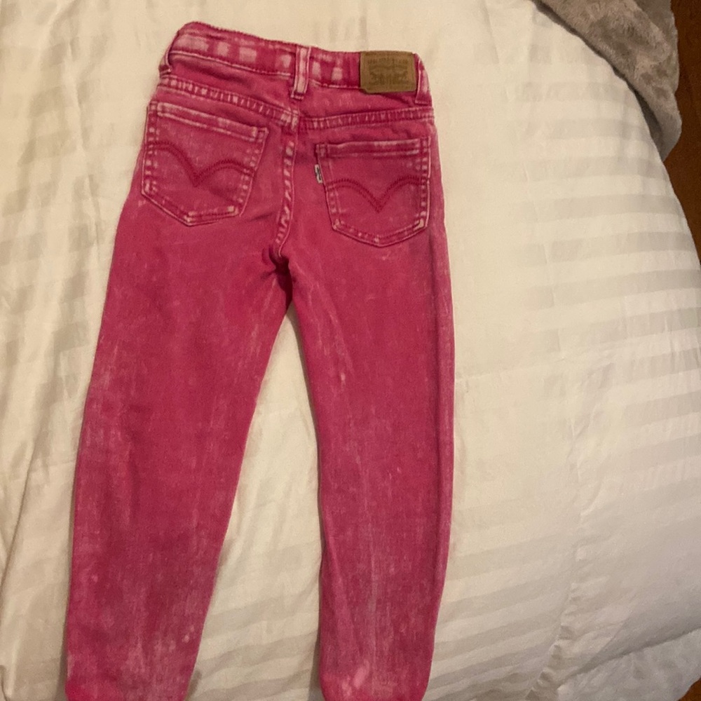 Adorable pink stone washed Levi jeans.